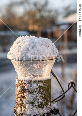 Snow-Covered Outdoor Post Light in Winter Morning Landscape Snow-Covered Outdoor Post Light in Winter Morning Landscape 134431036
