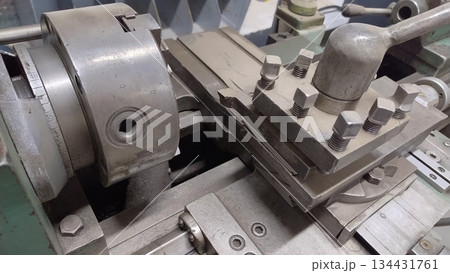 Old vintage rusty turning lathe. 134431761