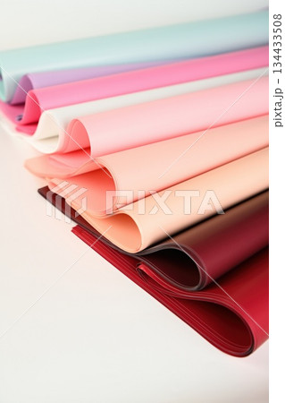 Stack of opaque florist wrapping paper sheets in pastel and red colors isolated on white background for flower packaging and gift wrapping Stack of opaque florist wrapping paper sheets in pastel and red colors isolated on white background for flower packaging and gift wrapping 134433508