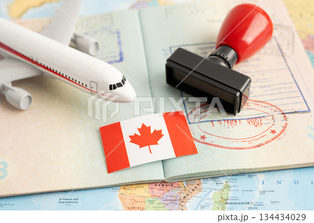 Approved Stamp visa and passport with Korea flag document to immigration at airport in country. Approved Stamp visa and passport with Korea flag document to immigration at airport in country. 134434029