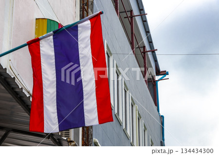 Thailand Thai flag blowing in the wind in the city. 134434300