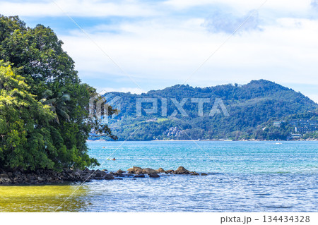Patong Beach Phuket with promenade boats turquoise blue water Thailand. 134434328