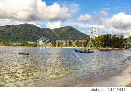 Patong Beach Phuket with promenade boats turquoise blue water Thailand. Patong Beach Phuket with promenade boats turquoise blue water Thailand. 134434334