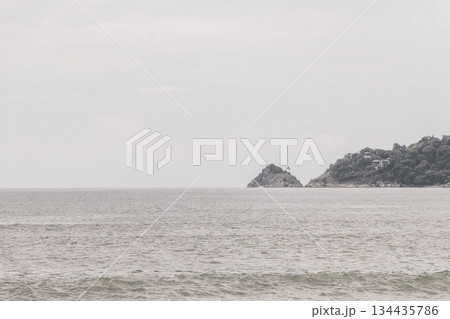Patong Beach Phuket with turquoise blue water and mountains Thailand. Patong Beach Phuket with turquoise blue water and mountains Thailand. 134435786