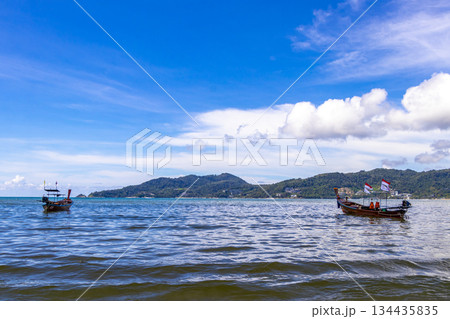 Longtail boat long tail boats at the Patong Beach Thailand. Longtail boat long tail boats at the Patong Beach Thailand. 134435835