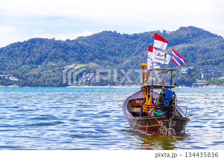 Longtail boat long tail boats at the Patong Beach Thailand. Longtail boat long tail boats at the Patong Beach Thailand. 134435836