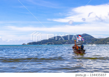 Longtail boat long tail boats at the Patong Beach Thailand. Longtail boat long tail boats at the Patong Beach Thailand. 134435837