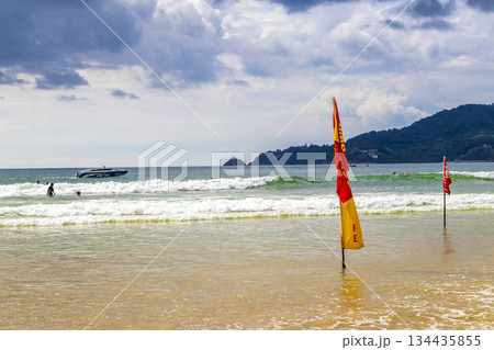 Patong Beach Phuket with red flag turquoise blue water Thailand. Patong Beach Phuket with red flag turquoise blue water Thailand. 134435855