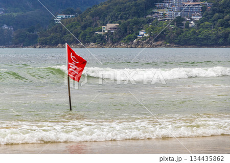 Patong Beach Phuket with red flag turquoise blue water Thailand. Patong Beach Phuket with red flag turquoise blue water Thailand. 134435862