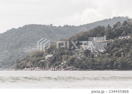 Patong Beach Phuket with turquoise blue water and mountains Thailand. Patong Beach Phuket with turquoise blue water and mountains Thailand. 134435868