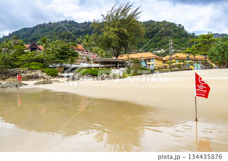 Patong Beach Phuket with red flag turquoise blue water Thailand. 134435876