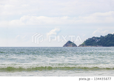 Patong Beach Phuket with turquoise blue water and mountains Thailand. Patong Beach Phuket with turquoise blue water and mountains Thailand. 134435877