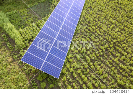 Blue solar panels for clean energy on green grass. Blue solar panels for clean energy on green grass. 134438434