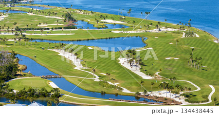 Big golf course field with green grass in Boca Grande, small town on Gasparilla Island in southwest Florida Big golf course field with green grass in Boca Grande, small town on Gasparilla Island in southwest Florida 134438445