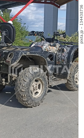 This image features a rugged all-terrain vehicle designed for off-road adventures. Ideal for outdoor exploration, recreation, or vehicle service promotions with a focus on adventure. 134438736