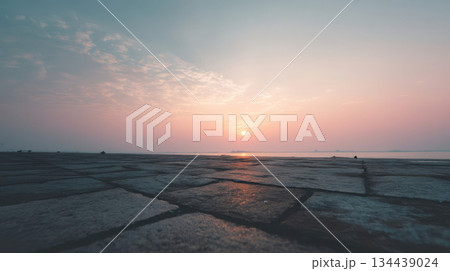 A nearly empty stone embankment at dawn over a calm river, a minimalist landscape with a soft pastel sky and a serene atmosphere 134439024