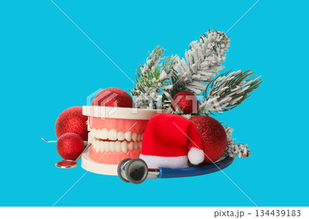 Tooth model and dental tools in holiday decor Tooth model and dental tools in holiday decor 134439183