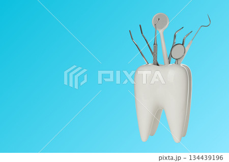 Dental tools are displayed in a tooth design on blue 134439196