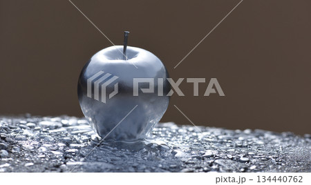 Silver metallic apple chrome sculpture grey monochrome color is modern art from steel or aluminum, copy space banner Silver metallic apple chrome sculpture grey monochrome color is modern art from steel or aluminum, copy space banner 134440762