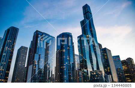 Skyscraper in city. City downtown with skyscraper. Office building business district. Modern building. Chicago city. High perspective. Skyscraper building architecture. Business skyscraper of glass Skyscraper in city. City downtown with skyscraper. Office building business district. Modern building. Chicago city. High perspective. Skyscraper building architecture. Business skyscraper of glass 134440805