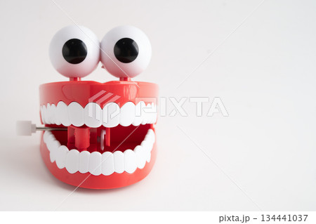Funny red teeth with eye toy denture model for dental health care. Funny red teeth with eye toy denture model for dental health care. 134441037