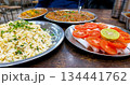 Traditional Indian Dhaba Meal with Rice, Curry, and Salad 134441762