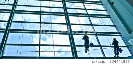 extreme work cleaning airport windows at height 134441987