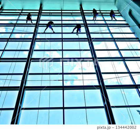 extreme work cleaning airport windows at height 134442002