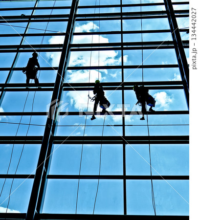 extreme work cleaning airport windows at height 134442027