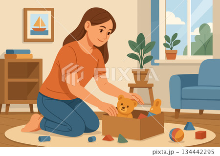 Mother tidying up scattered toys into box 134442295