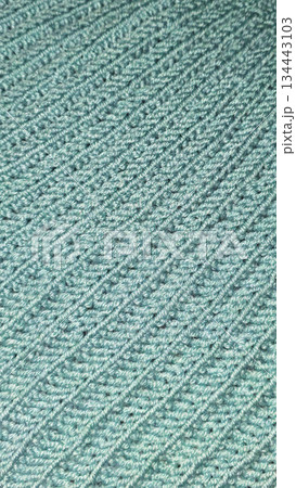 Knitting patterns and details for sweaters, hats, and other crocheted items. 134443103