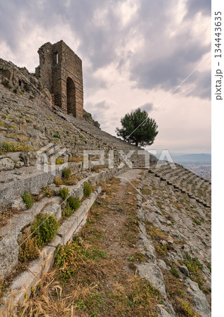 Ancient Great Theatre of Pergamon and Temple of Trajan on Acropolis under cloudy sky, Bergama, Turkey 134443635