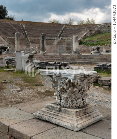 Ancient Corinthian capital and Roman Theater ruins at Asclepieion of Pergamon, Bergama, Turkey. Ancient Corinthian capital and Roman Theater ruins at Asclepieion of Pergamon, Bergama, Turkey. 134443673