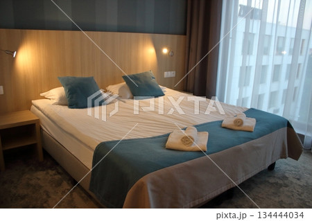 Modern hotel room with double bed interior 134444034