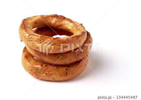 A pyramid of salted pretzels with poppy seeds isolated on a white background. 134445497