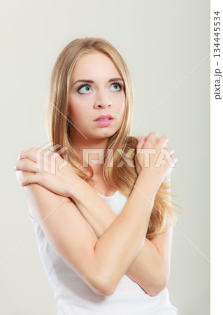 Shy girl, afraid woman on gray Shy girl, afraid woman on gray 134445534