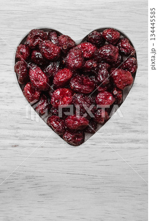 dried cranberry fruit heart shaped on wood board dried cranberry fruit heart shaped on wood board 134445585