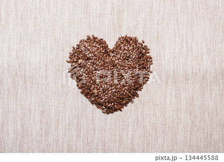 Raw flax seeds linseed heart shaped 134445588