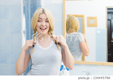 Lovely blonde woman in braids Lovely blonde woman in braids 134445790