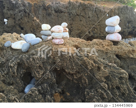 Stones pebbles stacked on the beach 134445969