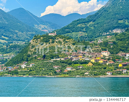 View of Iseo Lake Surrounded by Majestic Mountains and Clear Blue Skies, Italy View of Iseo Lake Surrounded by Majestic Mountains and Clear Blue Skies, Italy 134446717