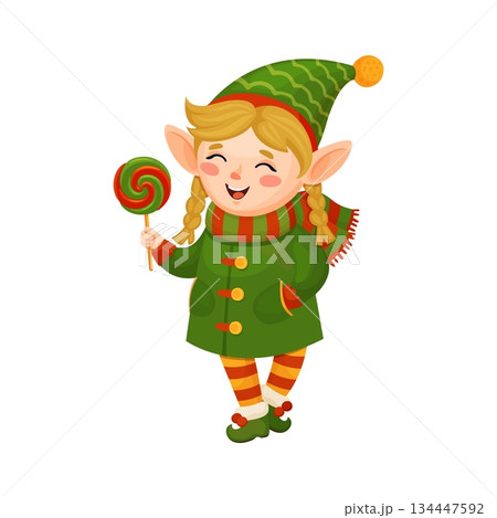 Christmas celebration elf girl cartoon fairy funny character. Xmas holiday elf funny character, Santa Claus helper cheerful vector personage. Christmas celebration fairytale mascot with lollypop candy 134447592