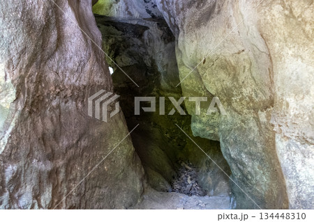 Inside view of an old underground cave in the mountains. Cave in the mountains. Inside view of an old underground cave in the mountains. Cave in the mountains. 134448310