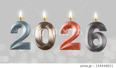 Bright glossy 2026 candles shining as New Year symbol, glowing flame and holiday joy on minimal Bright glossy 2026 candles shining as New Year symbol, glowing flame and holiday joy on minimal 134448651