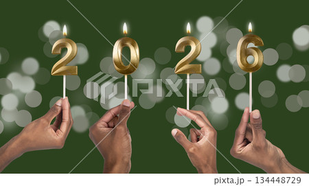 Hands holding shiny 2026 candle digits, concept of celebration, hope, new opportunities, and joyful 134448729