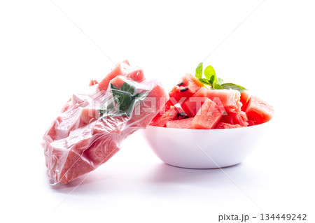 frozen watermelon in a vacuum bag and fresh in a plate frozen watermelon in a vacuum bag and fresh in a plate 134449242