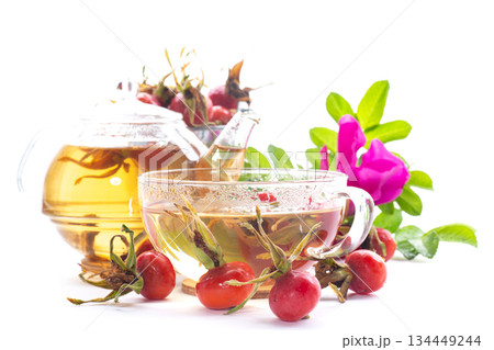 hot natural tea and rose hips on a white background 134449244