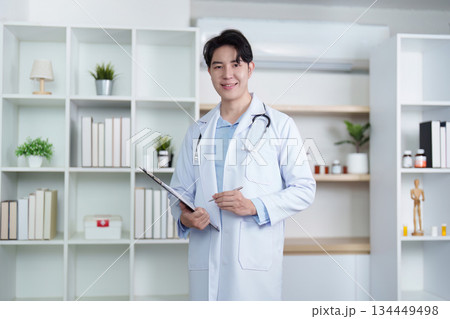 Healthcare Professional in White Coat with Clipboard Healthcare Professional in White Coat with Clipboard 134449498