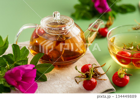 hot rosehip tea with flowers and berries 134449889