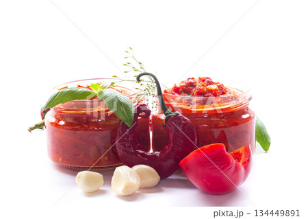 Spicy homemade condiment with red chili and green herbs 134449891